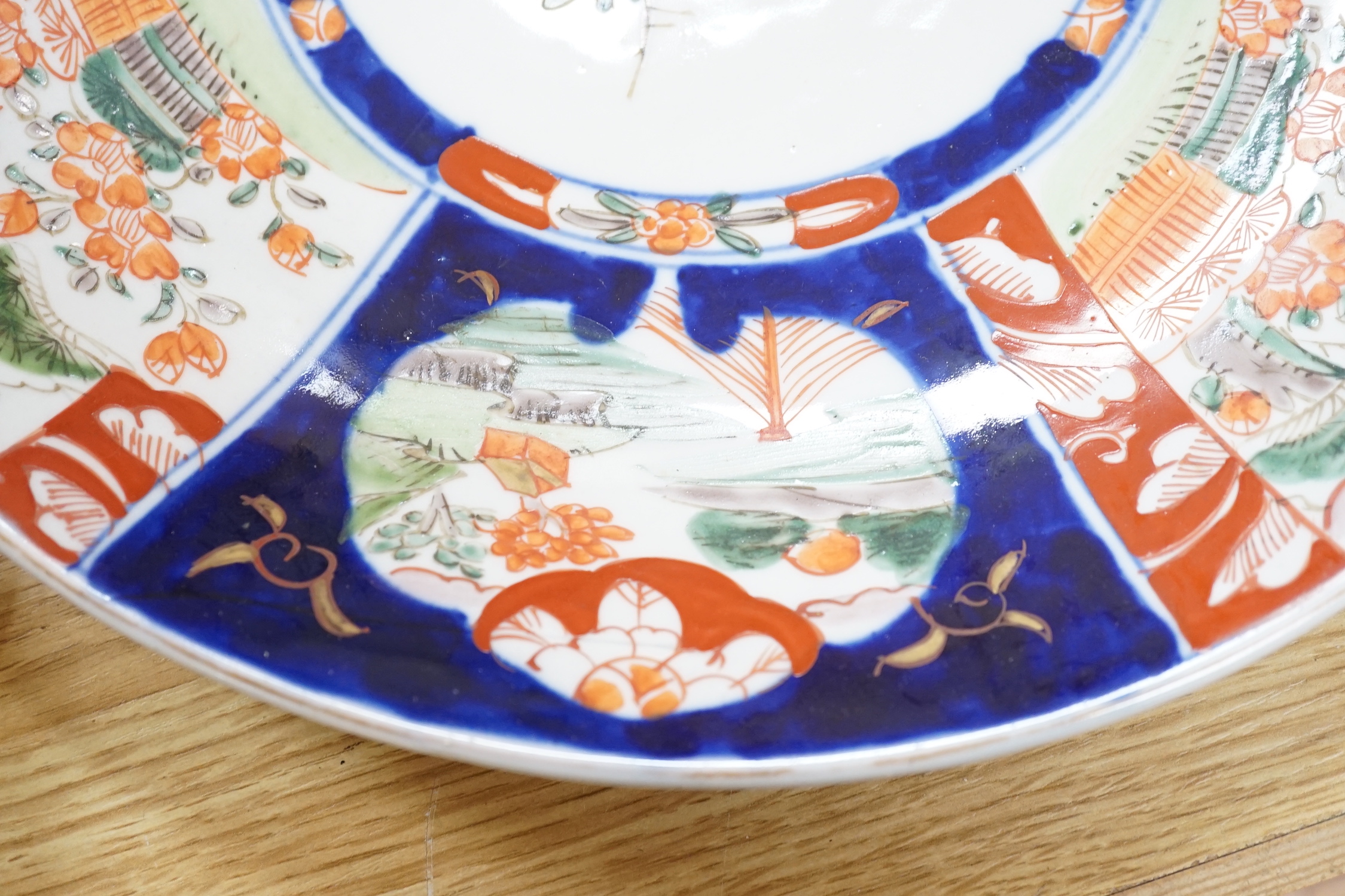 A Chinese two handled crackle glaze vase, Kangxi mark, but late 19th century, together two Imari plates, 37cm diameter